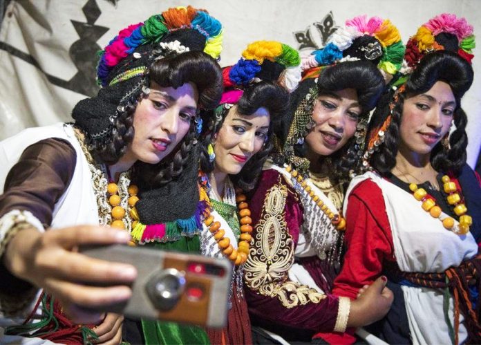At a wedding festival in central Morocco in September, Amazigh women pose for selfies