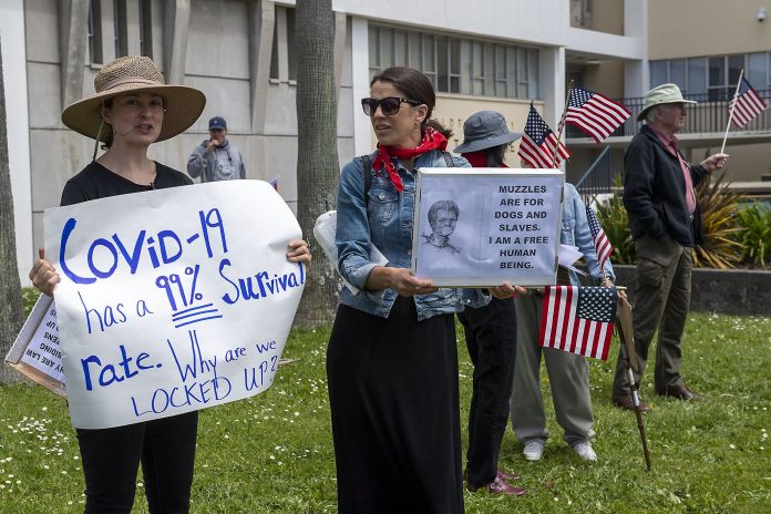 Deeply offensive racist placard displayed at a protest in the US stirs anger on social media